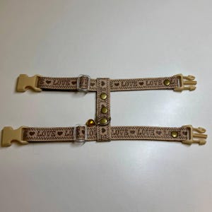 Cream ferret harness with the inscription LOVE