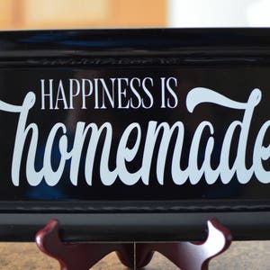 May include: Black tray with a white vinyl decal that reads "Happiness is homemade".