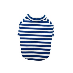 May include: A blue and white striped dog shirt. The shirt has a crew neck and short sleeves.