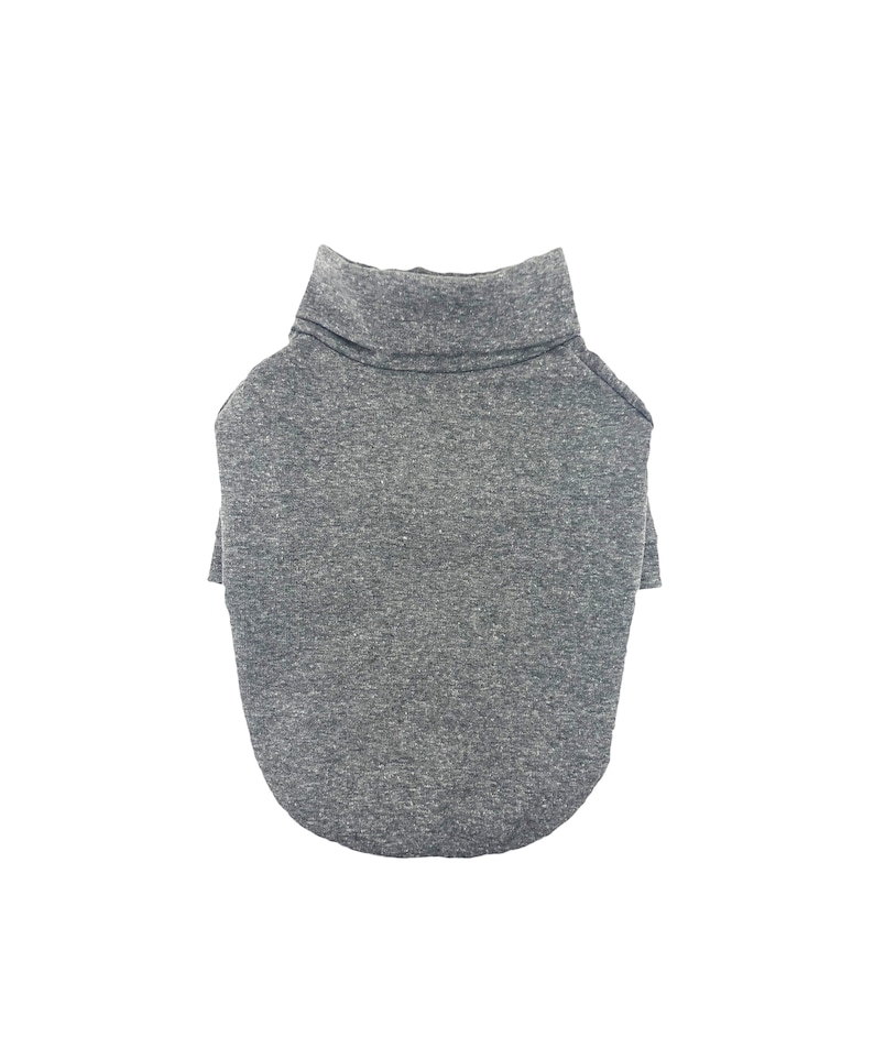 May include: A gray turtleneck sweater for a pet. The sweater is made of a soft, comfortable material and has a relaxed fit.