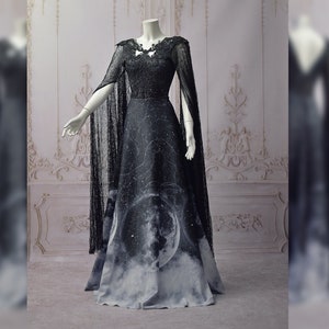 Gothic celestial wedding dress with moon phases, black mesh sleeves, fantasy witch gown with stars and lace