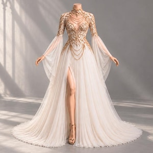 May include: A floor-length gown featuring a sheer white pleated skirt with a high front slit and long flowing sleeves. The bodice is adorned with intricate gold embroidery and delicate gold chain details across the chest and high neckline.