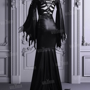 Back view of black wedding gown with lace-up corset detail