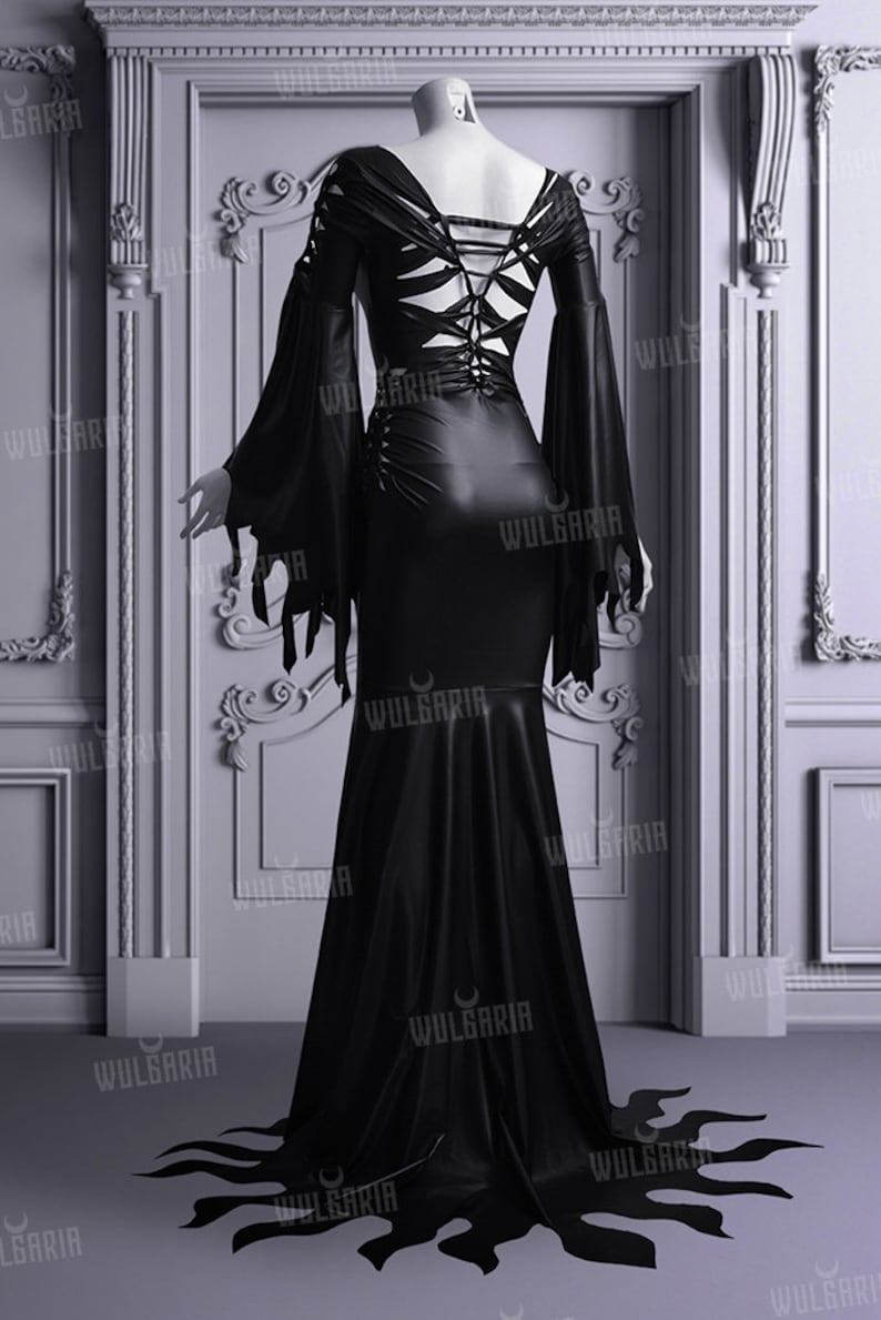 Back view of black wedding gown with lace-up corset detail
