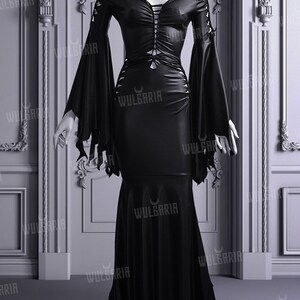 Gothic black wedding dress displayed with tattered sleeves