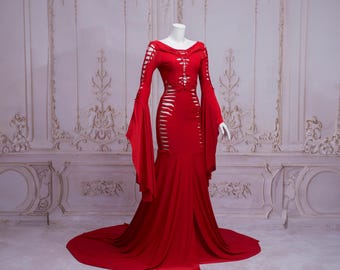 May include: A long, red, flowing gown with a fitted bodice and long, bell sleeves. The gown has a lace-up detail at the front and is made of a soft, stretchy fabric.