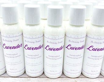 May include: Multiple white bottles of lavender-scented handcrafted moisturizing lotion, each with a purple label that reads "The Charming Bubble Lavender Handcrafted Moisturizing Lotion" and "Net Wt. 2 oz."