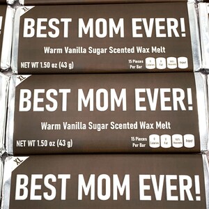 May include: Four brown wax melt bars with the text "BEST MOM EVER!" in white letters. Each bar is labeled "Warm Vanilla Sugar Scented Wax Melt" and has a net weight of 1.50 oz (43 g).