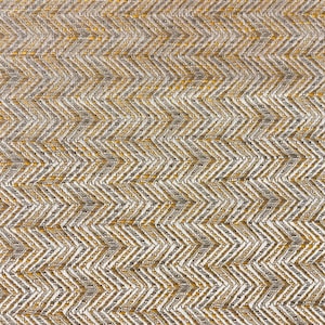 May include: A close-up of a textured fabric with a chevron pattern in shades of gold and white.