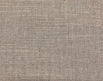 May include: Close-up of a beige woven fabric with a subtle texture. The fabric has a slightly rough feel and a natural, earthy tone.