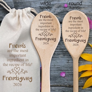 May include: Two light-colored wooden spoons and a beige drawstring fabric bag, each engraved with the text: Friends are the most important ingredient in the recipe of life! Friendsgiving 2026. One spoon has a wide handle and one has a round handle.