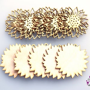 May include: A selection of wooden sunflower cutouts and sunburst-shaped wooden tags. The sunflower cutouts feature detailed petal designs and a central pattern of small holes. The tags are plain with a jagged edge and a small hole for hanging.