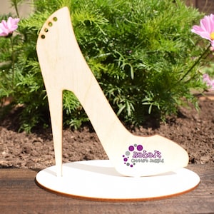 Laser Cut High Heel Stiletto shoe on a plinth