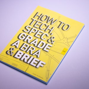 Puede incluir: Un libro amarillo con el título "How to Tech, Spec & Grade a Bra & Brief" en texto negro. La portada del libro presenta una ilustración en blanco y negro de un patrón de sujetador.