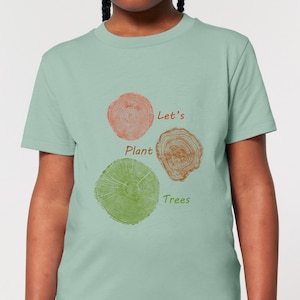 May include: A light blue t-shirt with a graphic of three tree rings. The text "Let's Plant Trees" is printed on the shirt.