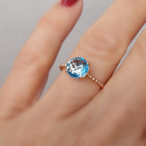 Bague solitaire argent doré or rose et topaze bleue ronde taille briolette