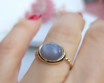 Fine gold-plated silver ring set with a gray moonstone oval cabochon