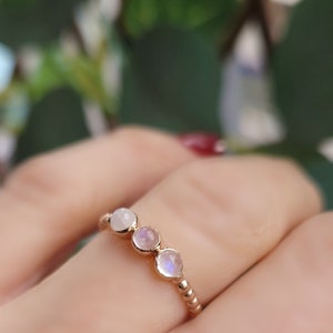 Mini 925 silver ring gilded with rose gold set with three small cabochon moonstones