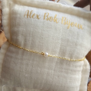 Golden silver chain bracelet and small white pearl