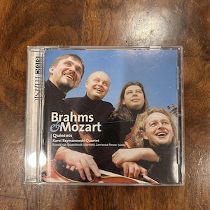 May include: A CD case featuring the album "Brahms & Mozart Quintets" by the Karol Szymanowski Quartet. The cover shows four smiling musicians. The BBC Music logo is visible on the left side of the case.