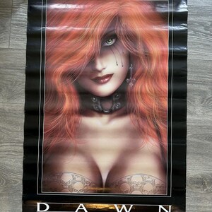 May include: A poster featuring a woman with long, red hair and green eyes. The image has a fantasy theme, with the word "DAWN" prominently displayed at the bottom. The poster is black with white text and a border. The poster is by Michael Linsner.