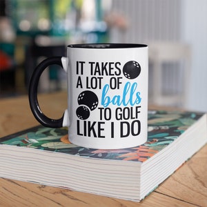 It takes a lot of balls novelty golf mug. Perfect Christmas gift for golfers.