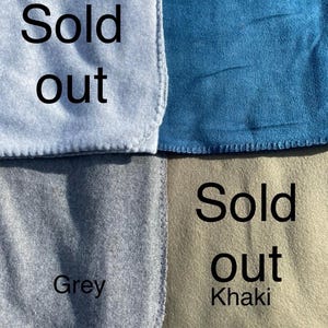 May include: Four fabric swatches in light grey, dark blue, grey, and khaki. The light grey and khaki swatches are labelled with the text 'Sold out'. Each swatch features a finished edge with visible stitching along the border.