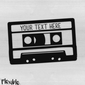 May include: Black cassette tape design with the text "YOUR TEXT HERE" in a clean, sans-serif font. The design includes the Flexible Designs logo in the bottom left corner. The cassette tape is a retro design.