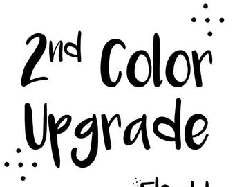 May include: White background with black text that reads "2nd Color Upgrade". Below the text is the word "Flexible" with the word "designs" below it. There are small black dots around the text.