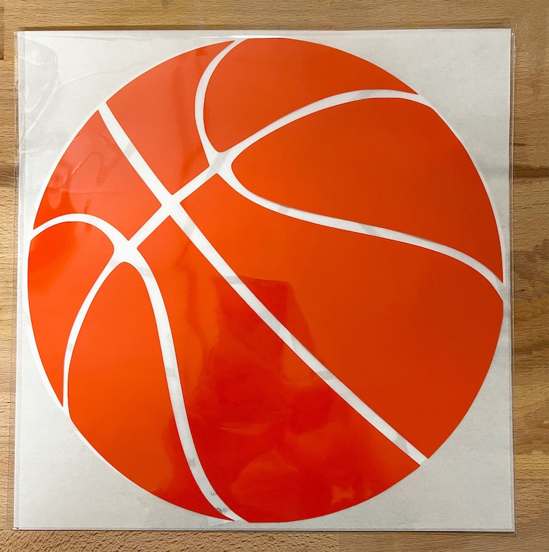 May include: A round orange basketball sticker with white lines. The sticker has a glossy finish. The design is a classic representation of a basketball, suitable for sports fans.