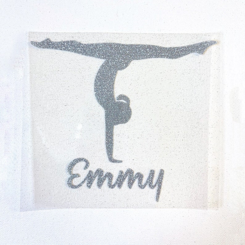 Vinyl iron on transfer of gymnast or dance doing a split handstand
