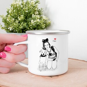May include: White enamel camping mug with a black and white illustration of a person and a dog. The person is wearing a cheerleading uniform and has a red heart with the word "Campus" above it.