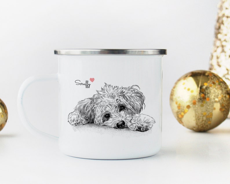 May include: White enamel mug with a black and white illustration of a dog with the name "Scruffy" written in black text and a small red heart.