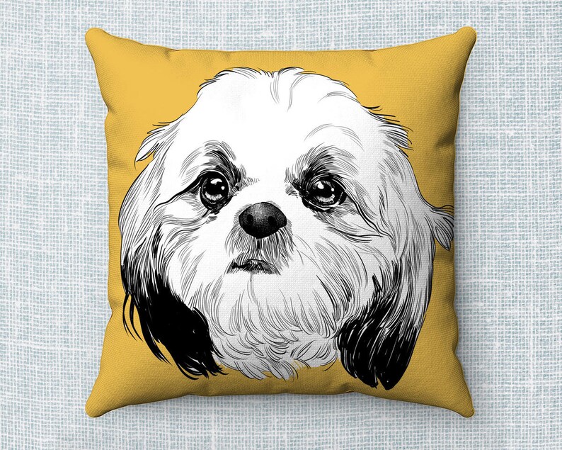 May include: A yellow throw pillow with a black and white illustration of a Shih Tzu dog's face.