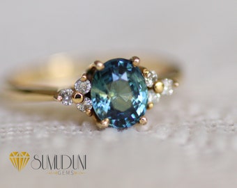 Teal sapphire engagement ring. Peacock Green Sapphire Oval Diamond Ring 14k Yellow gold.Bi color sapphire ring