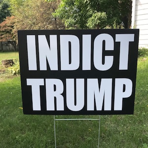 May include: Black and white sign with the text "INDICT TRUMP" in white letters on a black background.