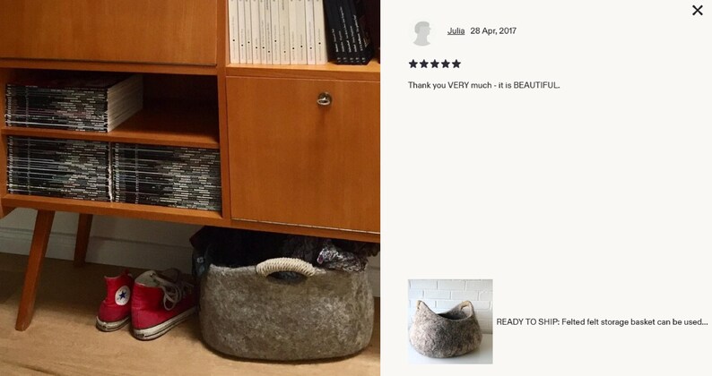 Felted wool storage basket in grey with two wrapped handles; cozy cat bed with a sleeping cat inside.