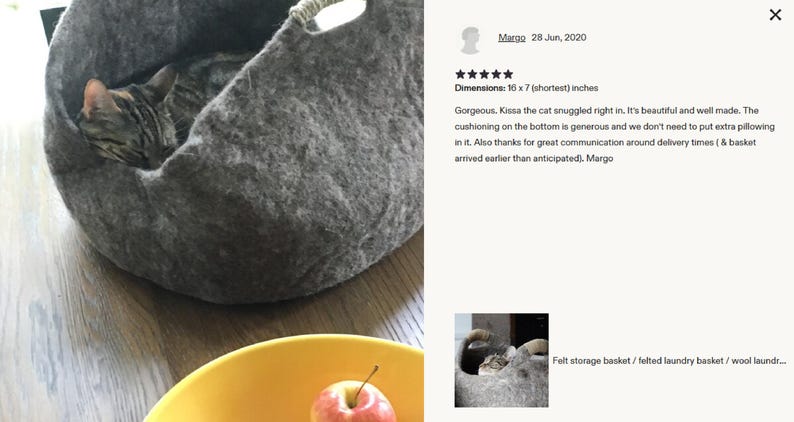Felted wool storage basket in grey with two wrapped handles; cozy cat bed with a sleeping cat inside.