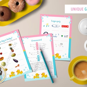 May include: Printable baby shower game cards with a pink and blue color scheme. The cards feature a variety of games, including a crossword puzzle, a logo quiz, and a "How big is baby?" game. The cards are decorated with a yellow rubber ducky and bubbles.