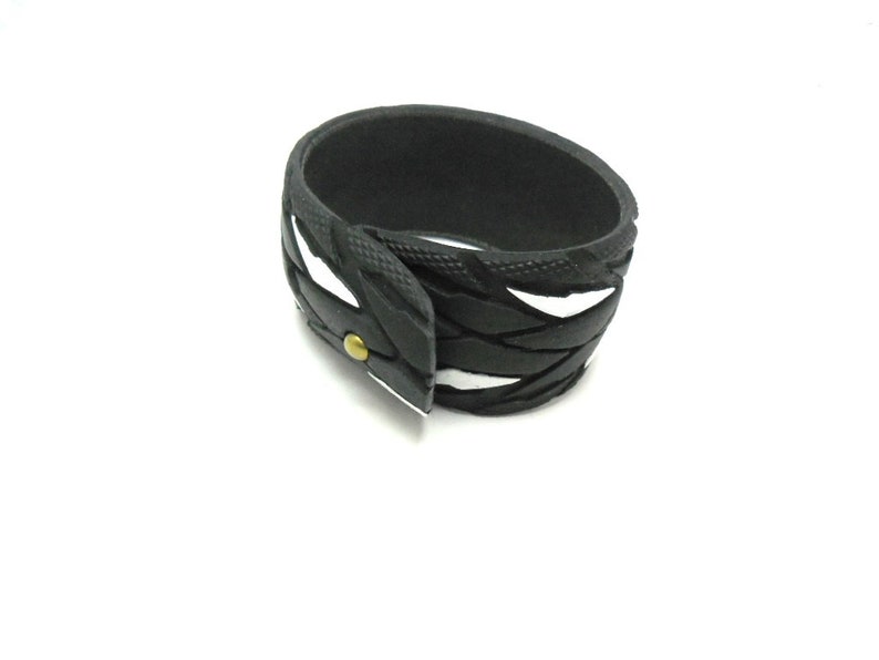 Bracelet made from recycled bicycle tires.