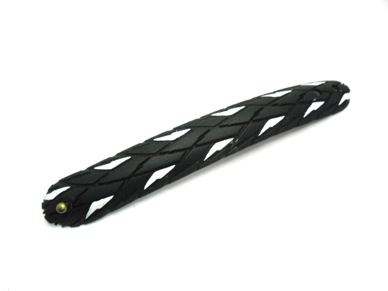 Bracelet made from recycled bicycle tires.