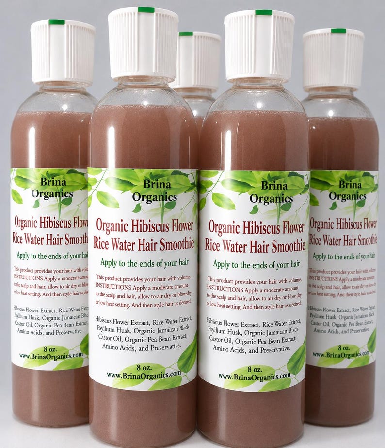 May include: Five clear plastic bottles filled with a brownish liquid, each topped with a white cap. The labels read Brina Organics Organic Hibiscus Flower Rice Water Hair Smoothie, listing ingredients and instructions, with a net weight of 8 oz.