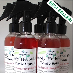 May include: Five clear plastic spray bottles filled with a reddish liquid. Each bottle features a black trigger sprayer and a white label with the text Brina Organics Speedy Herbal Hair Tonic Spray Saw Palmetto Berry & Sea Moss. A green banner reads BEST SELLER.