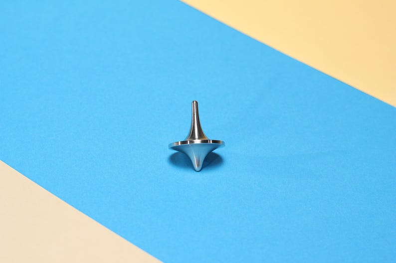 The Spin Stainless Steel Spinning Top // fidget // Stress Management // Gyro image 1
