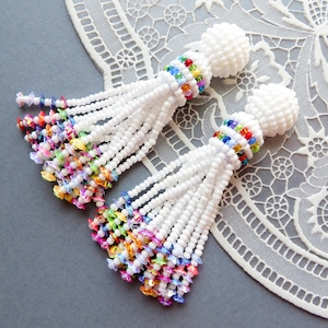 White beaded tassel earrings Multicolor Flowers clip on earrings Rainbow stud seed bead earrings Oscar de ra renta earrings Statement tassel
