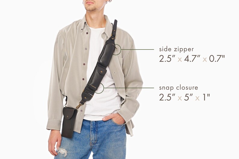 May include: A black leather shoulder strap accessory featuring two attached pouches. One pouch has a side zipper measuring 2.5 inches by 4.7 inches by 0.7 inches, and the other has a snap closure measuring 2.5 inches by 5 inches by 1 inch.