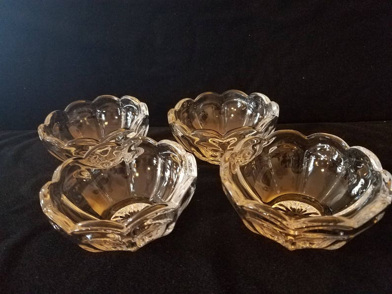 Set of four Heisey ColonialOld Williamsburg clear nappies 4 34 in diameter and 2 inches in height