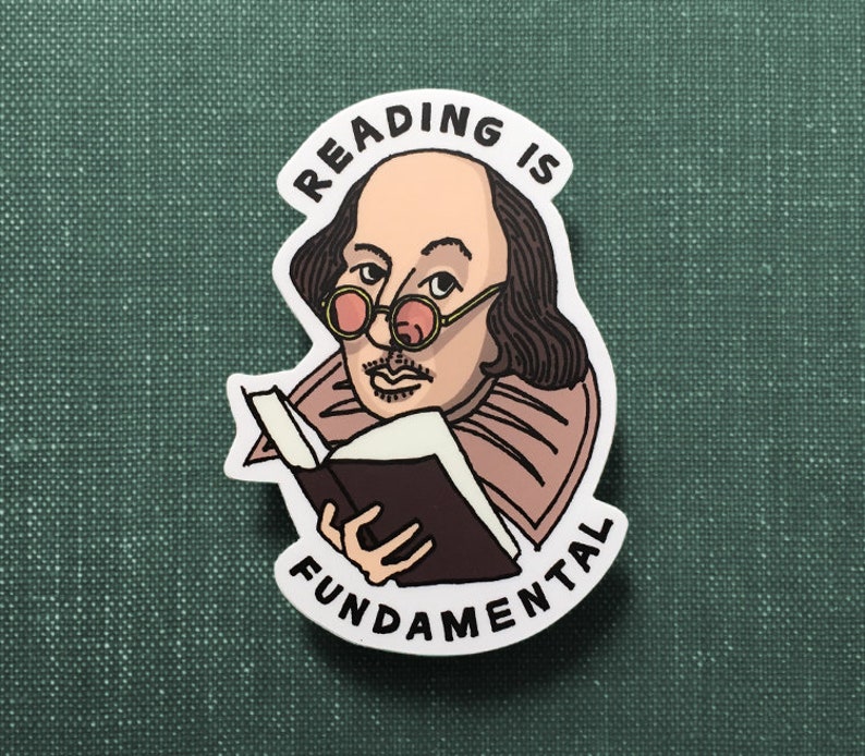 Matte sticker resting on a green, clothbound book. The sticker features an illustration of  William Shakespeare, wearing pink-tinted glasses, as he holds a book. His right eyebrow is cocked while making a deadpan expression at you.