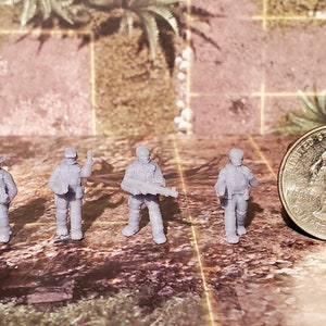 May include: Four gray plastic miniature figures of soldiers, each holding a weapon, standing on a brown and gray tiled surface. A US quarter is in the background for scale.