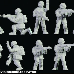May include: A set of ten white plastic miniature figures of soldiers in various poses, holding rifles and other weapons. The figures are all wearing helmets and body armor. The text "COMBAT PATCH; DIVISION/ BRIGADE PATCH" is printed at the bottom of the image.